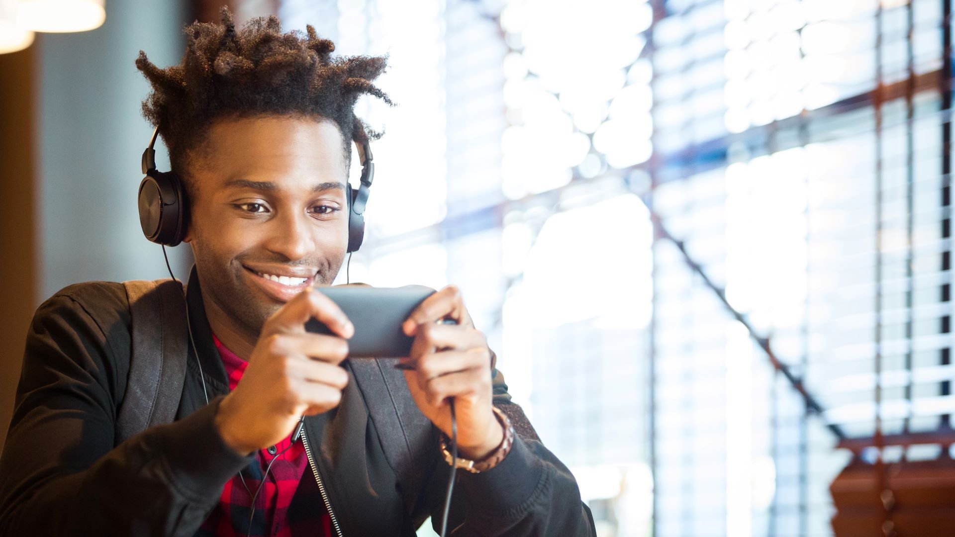 Social media user watching a video on his smartphone