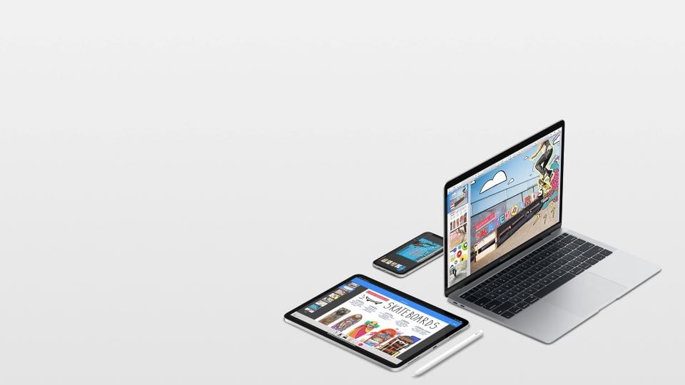Apple branded Macbook, iPad, and iPhone displaying videos