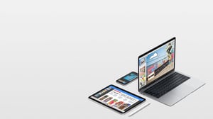 Apple branded Macbook, iPad, and iPhone displaying videos