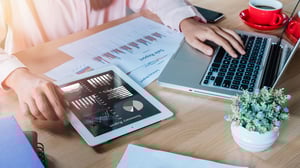 Sales manager reviewing charts of qualified leads