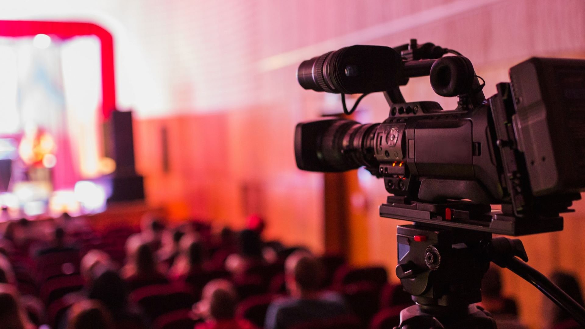 Professional video camera filming a business event marketing video